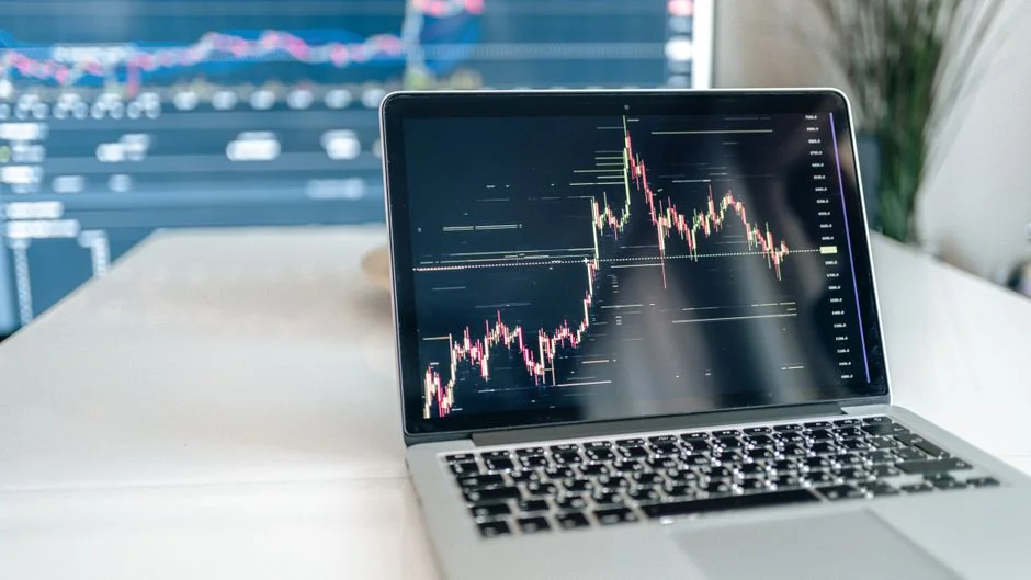 Hands discussing marketing strategy with charts in an office setting.